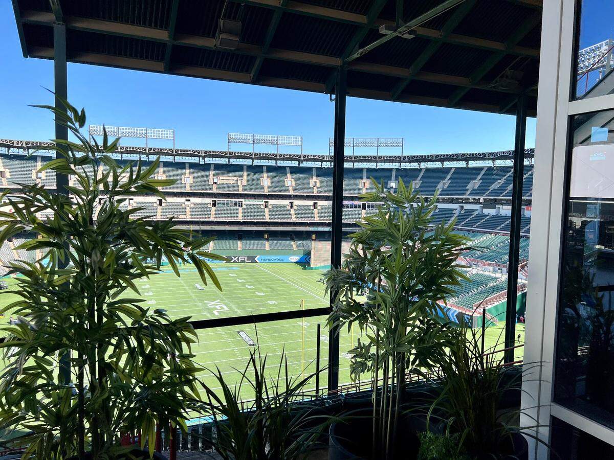 The Choctaw Stadium field is visible from a cigar bar smoking deck at Hearsay in Arlington, March 5, 2023.