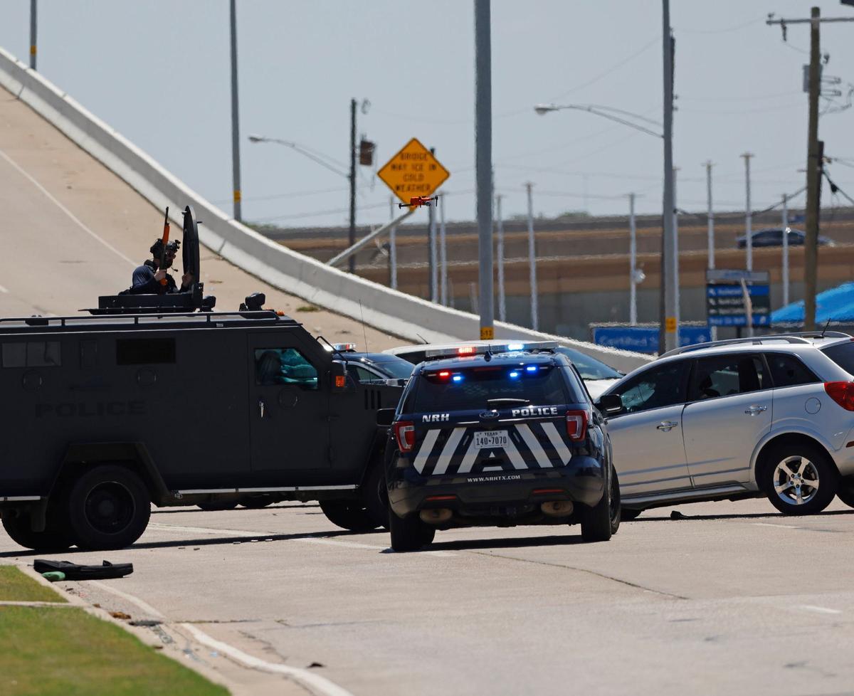 A police standoff in North Richland Hills on Davis Boulevard on Saturday, Aug. 3, 2024, ended when officers fired several rounds of gas through the suspect’s front windshield. The suspect was taken into custody.