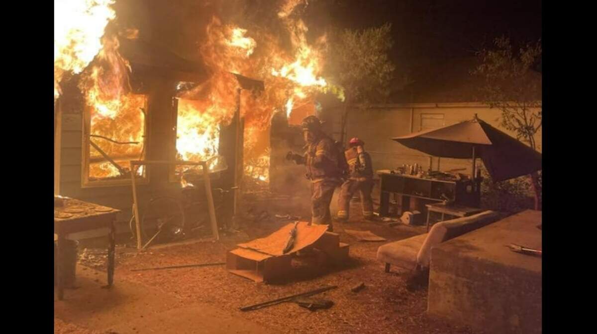 A man wearing only red boxer shorts fled the scene of this house fire in White Settlement on Saturday night, authorities said. No injuries were reported.