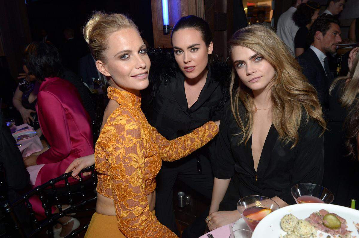 From left, Poppy Delevingne, Tallulah Harlech and Cara Delevingne attend the ELLE Style Awards 2014 at One Embankment on Tuesday Feb. 18, 2014, in London. (photos by Jon Furniss/Invision/AP)