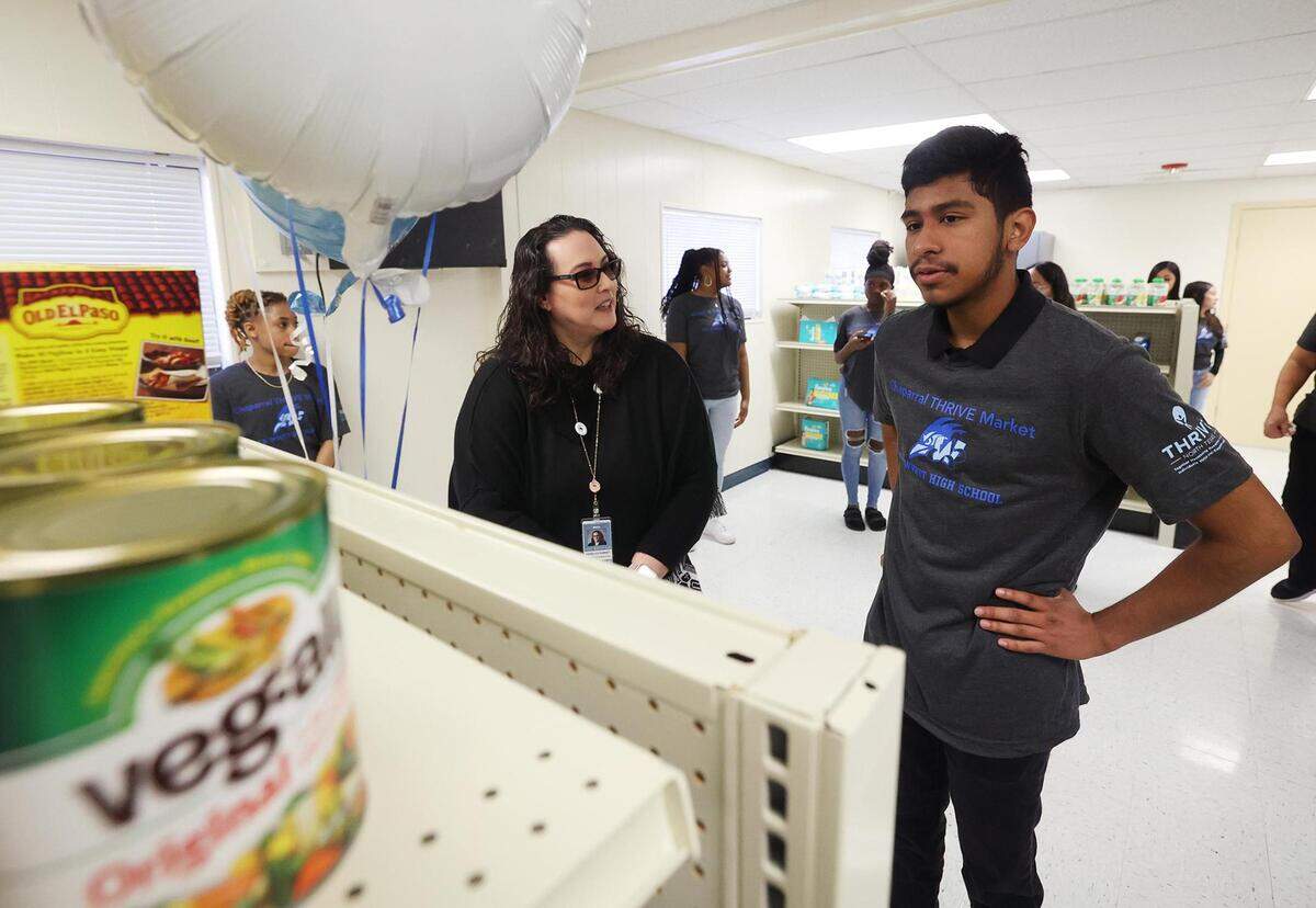 Fort Worth ISD Superintendent Angélica Ramsey, left, talks to O.D. Wyatt High senior Omar Almaraz, 18, during the grand opening of the on-campus grocery store provided in partnership with Texas Health Resources’ THRIVE North Texas program on Wednesday, January 31, 2024. Almaraz is one of the approximately 10 students that will help run the grocery store, learning real-world and leadership skills in the process.