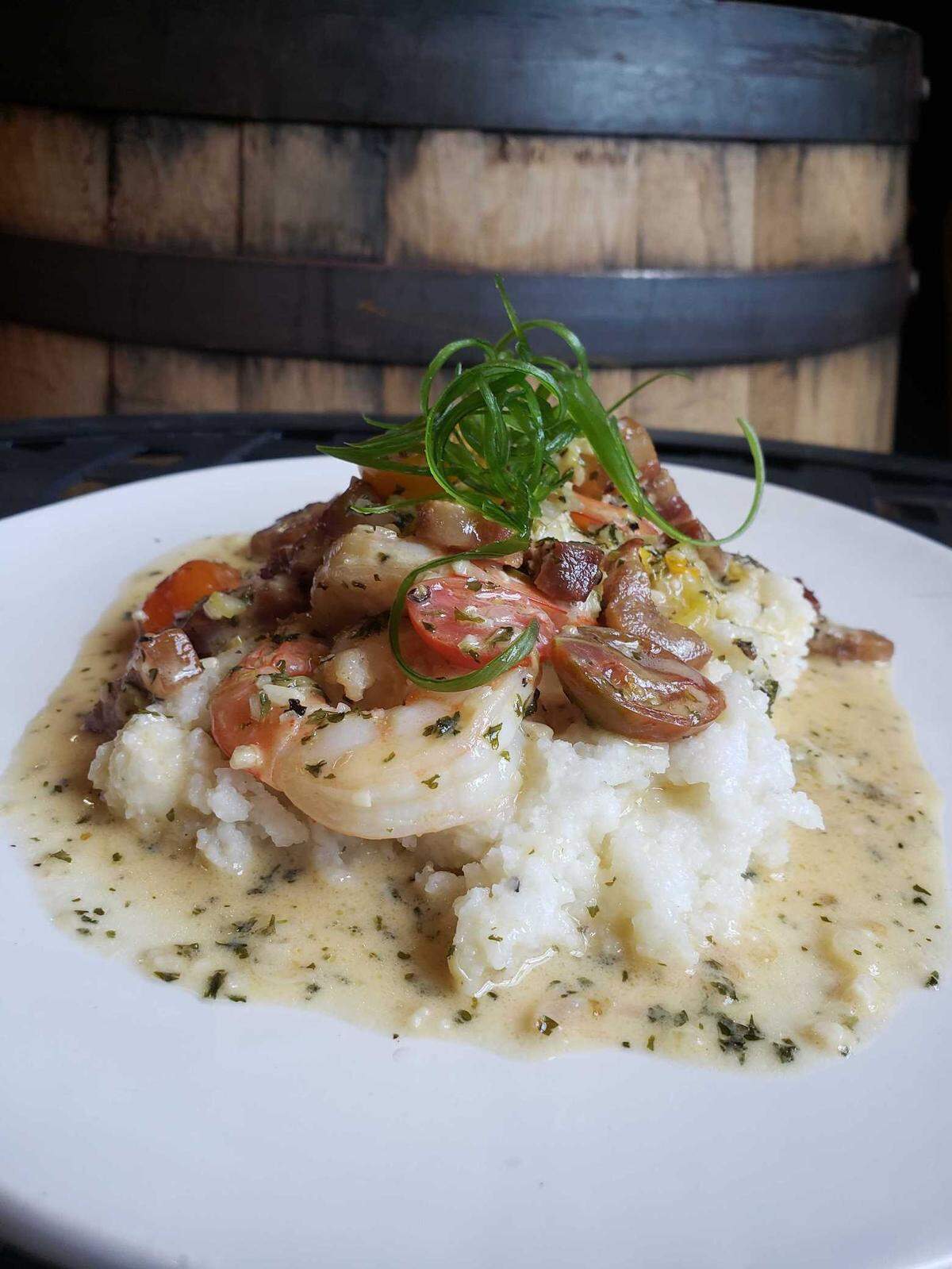 It Ain’t Shrimpin’ If You Got It, the shrimp and grits dish on Funky Picnic Brewery & Restaurant menu, includes bacon, shallots, garlic, cherry tomatoes, green onions and a creamy wine sauce.