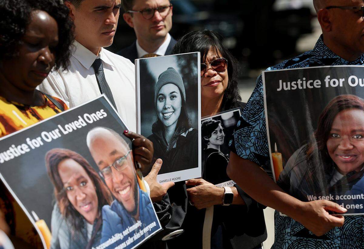 Families of victims of the 2019 Boeing 737 Max jetliner hold photographs of their loved ones outside of the federal court in Fort Worth on Wednesday, Sept. 3, 2025. Relatives of the crash victims were allowed to speak in a hearing on the U.S. government's motion to dismiss a felony conspiracy charge against Boeing. 