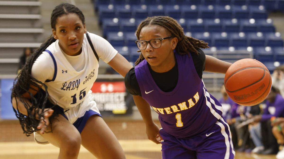 Everman shooting guard Makhiya Dangerfield (1) drives the ball on Mansfield Summit shooting forward Zamyrah Agee (15) during the first half of a UIL girls basketball game between Everman and Mansfield Summit at Summit High School in Mansfield, Texas, Thursday Jan. 22, 2026