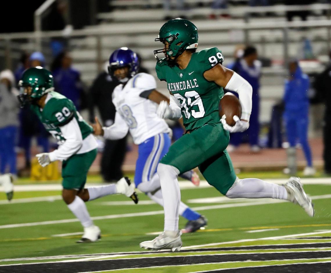 Kennedale’s Poasa Utu (99) returns a kickoff to put the Wildcats up 16-0 in the first half of a District 6-4A D1 high school football game at Wildcat Stadium in Kennedale, Texas, Friday, Nov. 04, 2022. Kennedale led Dunbar 50-0 at the half. (Special to the Star-Telegram Bob Booth)