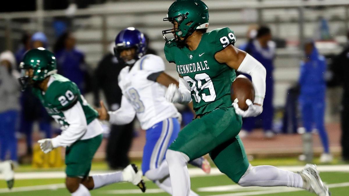 Kennedale’s Poasa Utu (99) scored two touchdowns in the Wildcats 64-0 win over Dunbar. (Special to the Star-Telegram Bob Booth)