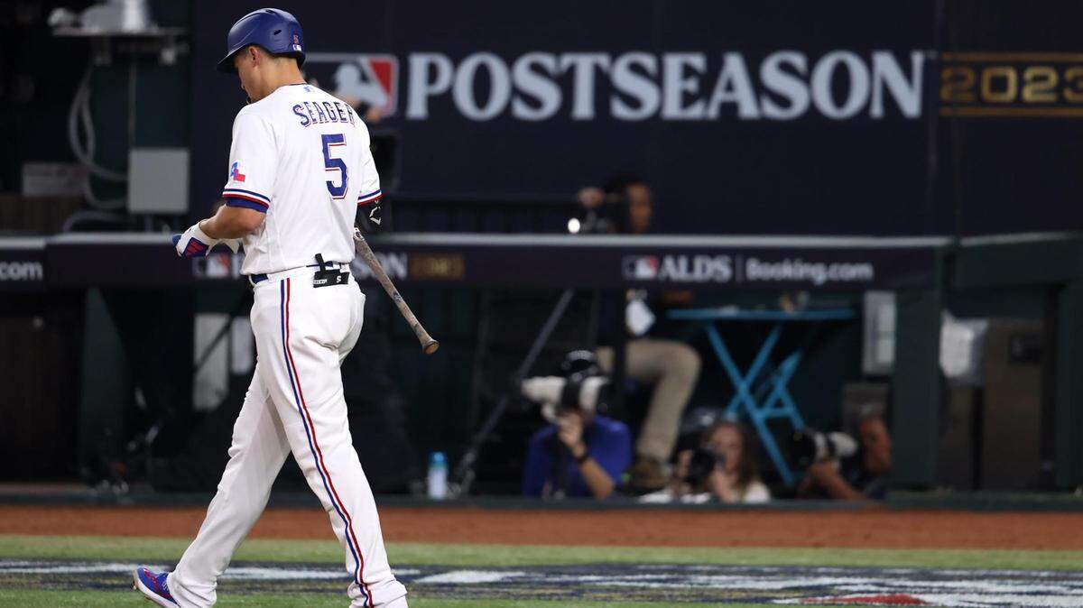 Texas Rangers shortstop Corey Seager is walked by Baltimore Orioles pitcher Dean Kremer in the second inning of Game 3 of the ALDS on Tuesday, October 10, 2023, at Globe Life Field in Arlington.