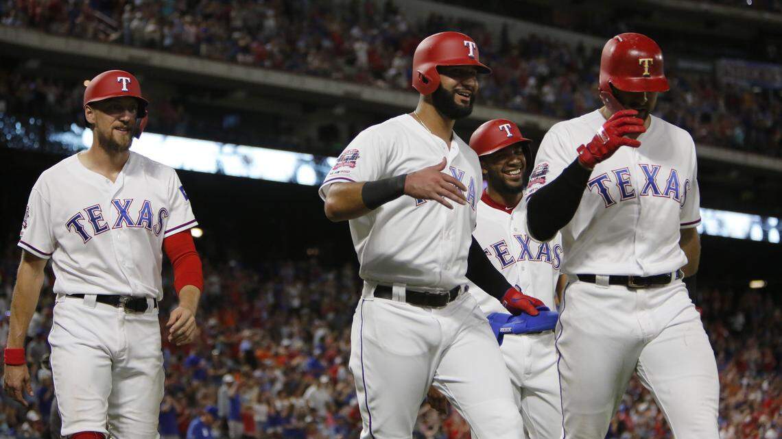 Hunter Pence, Nomar Mazara, Elvis Andrus and Joey Gallo walk off together after Gallo’s grand slam in the sixth inning. The Kansas City Royals play the Texas Rangers at Globe Life Park Friday, May 31.