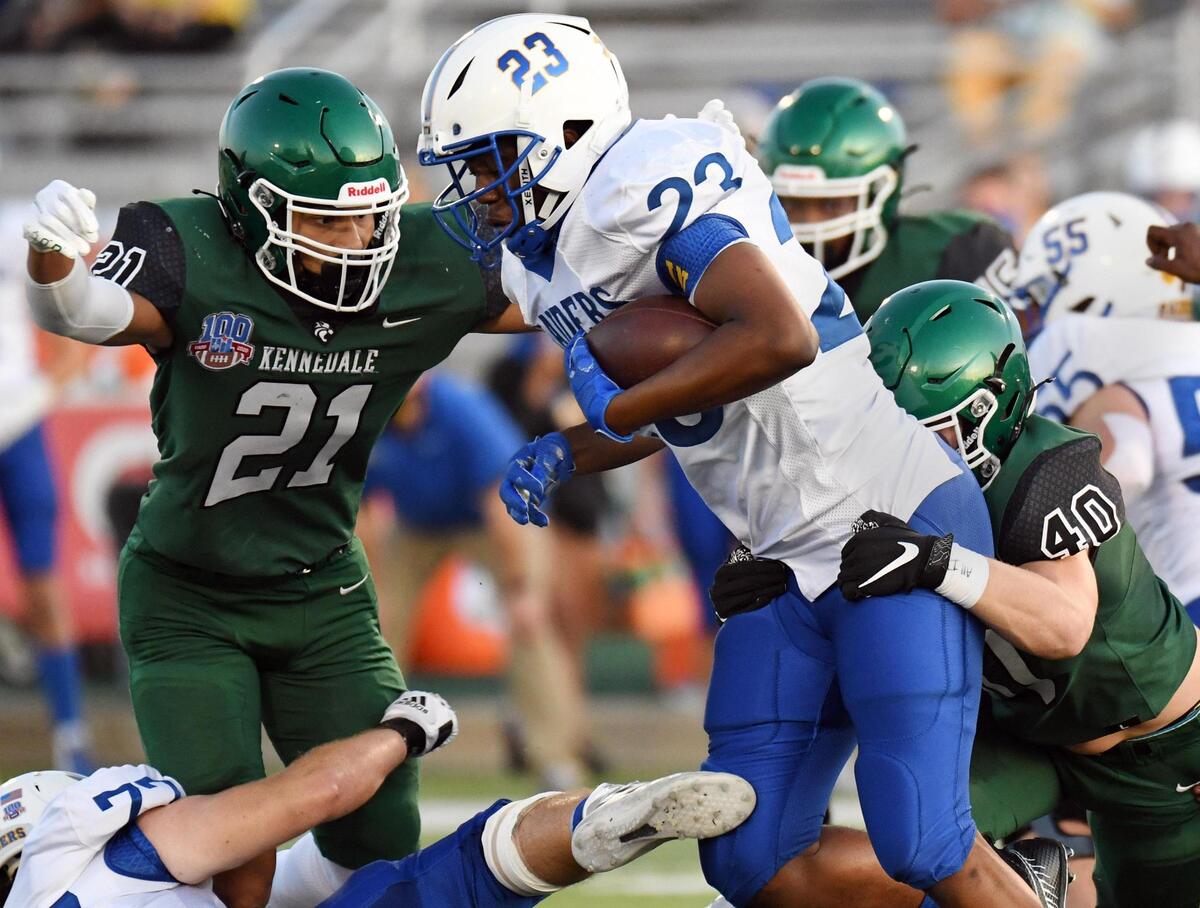 Kennedale’s Braden Waters, left and RJ Pepper tackle Sunnyvale’s Obi Arinze as he carries the ball past the line of scrimmage in the first quarterof their football game Friday, September 11, 2020 in Kennedale, Texas. Special/Bob Haynes