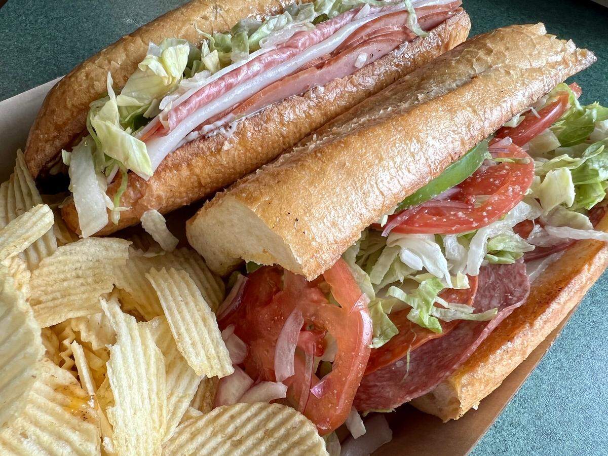 An oversized Italian grinder with provolone and vinaigrette at Colossal Sandwich Shop.