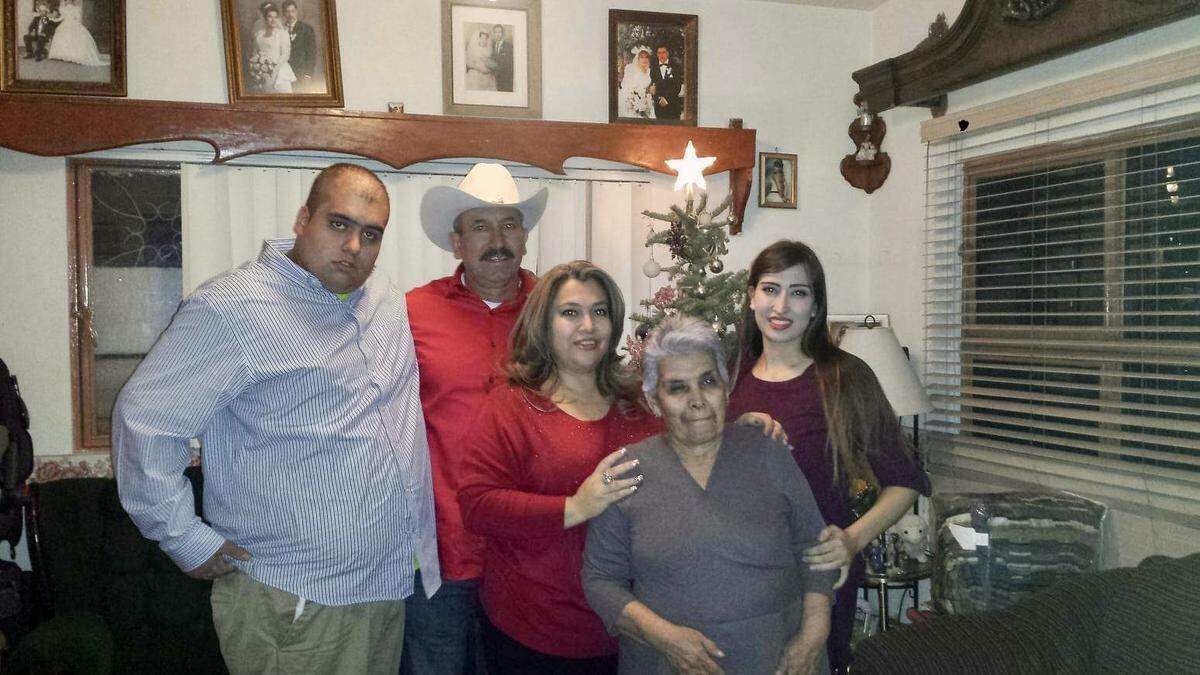 The Estrada family, David, Evodio, Sandra, and Daisy with grandmother Rosa Muñoz, prepares to attend Christmas Eve Mass in Chihuahua, Mexico in 2016.