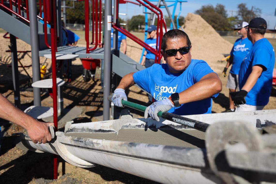 Volunteers with American Airlines helped built a new playground at Worth Heights Elementary School in Southside Fort Worth late last year. An American Airlines employee that helped oversee the construction crew, including Beto Resendiz pictured here, grew up in the neighborhood.
