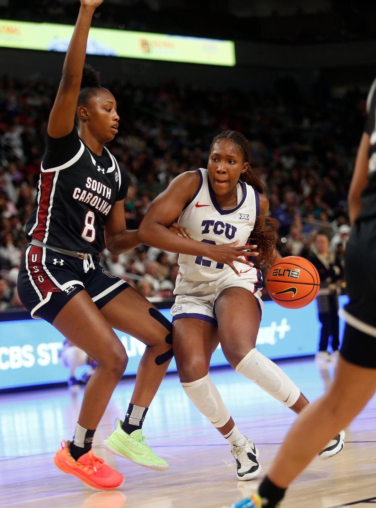 TCU’s Agnes Emma-Nnopu drives to the hoop as South Carolina’s Joyce Edwards defends during their game on Sunday, December 8, 2024 at Dickies Arena.
