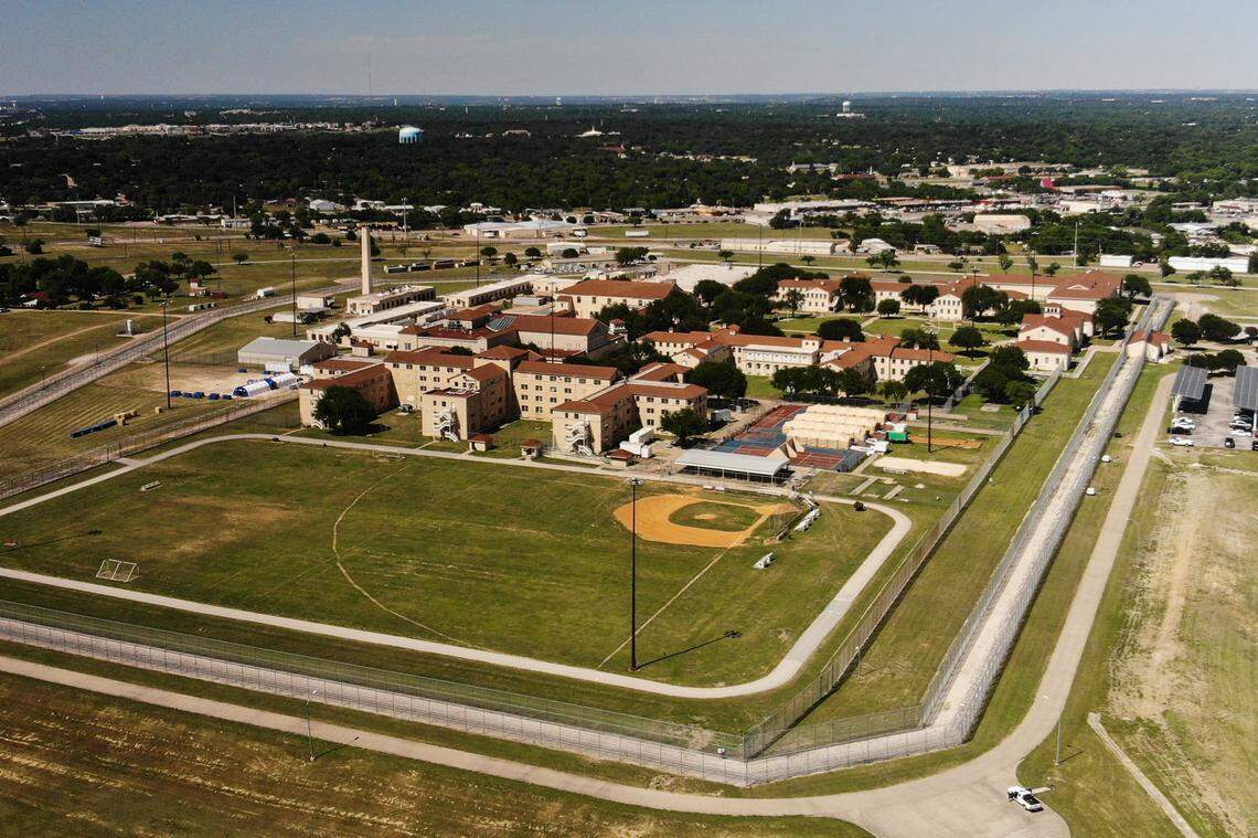 Tents to treat coronavirus patients were erected on the tennis courts at the Federal Medical Center prison for men in Fort Worth.