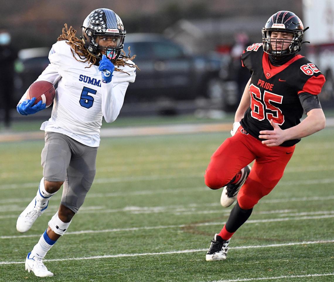 Mansfield Summit’s Sean Smith, left takes a punt return past Colleyville’s Jake Eldridge for the touchdown and a 34-17 lead in the fourth quarter of their Division 1-5A Regional Round Play-off football game Saturday, December 26, 2020 at Bearcat Stadium in Aledo, Texas. Summit went on to win 34-31. Special/Bob Haynes