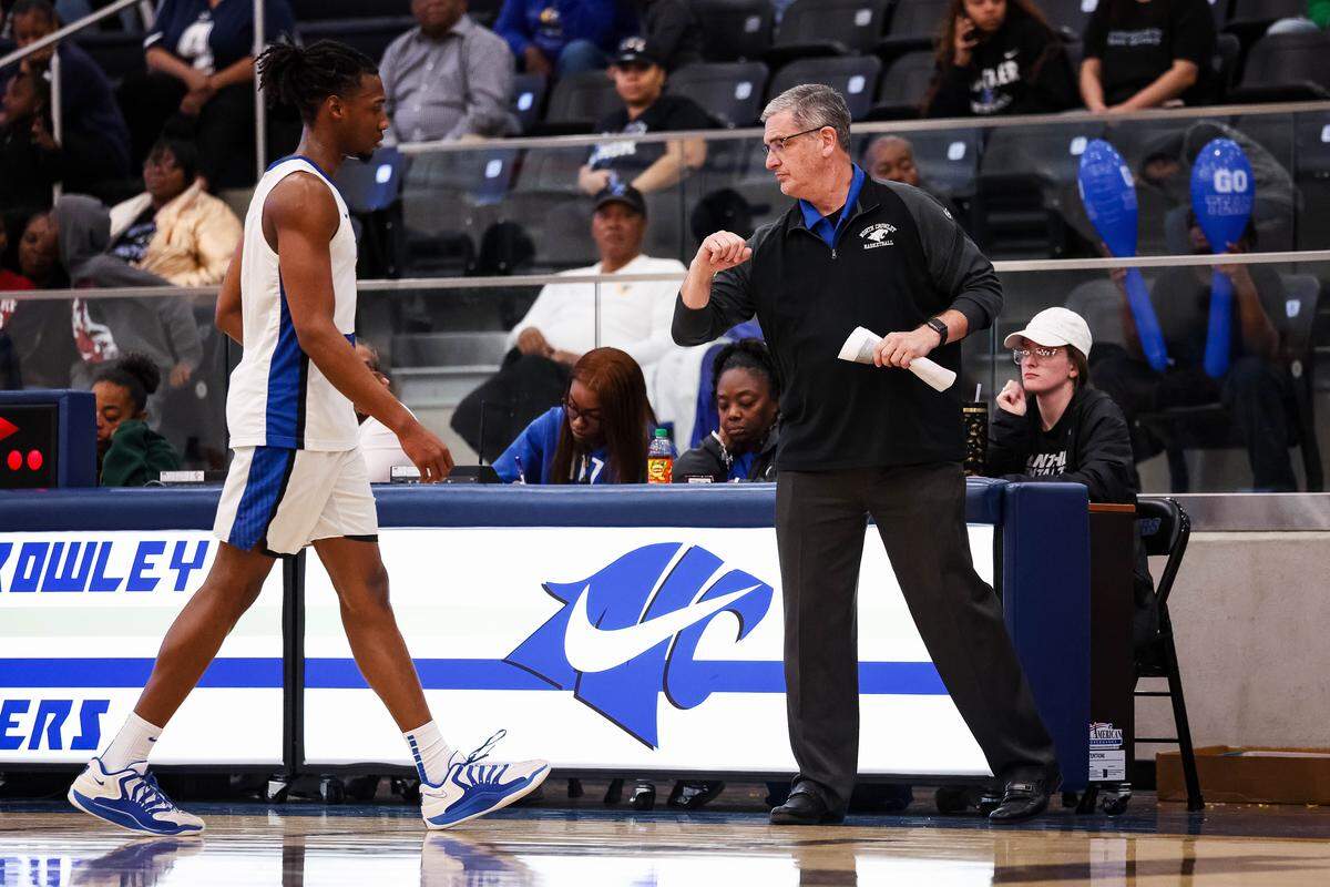 North Crowley head coach Tommy Brakel greets guard Alex Barther II as he comes out of the game against Weatherford on Feb. 6 at North Crowley.