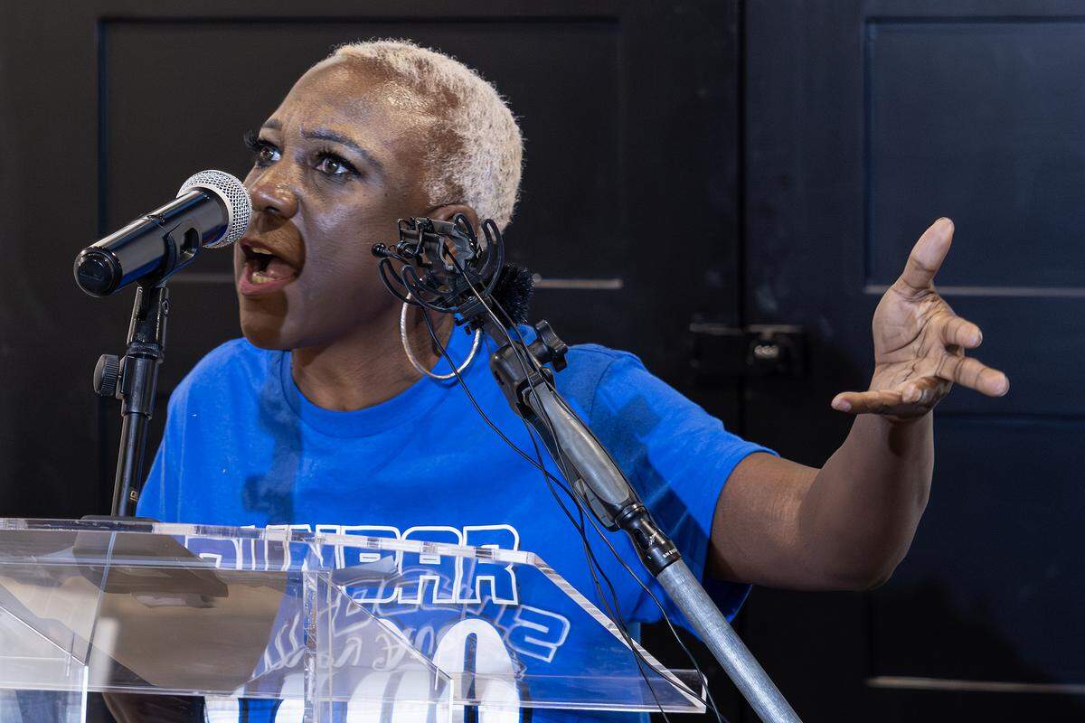 Community activist Keisha Braziel speaks to the media gathered for a news conference regarding the Texas Education Agency’s takeover of Fort Worth ISD.