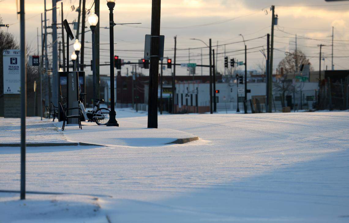 The sun rises over a snow covered Near Southside on Sunday, Jan. 25, 2026.