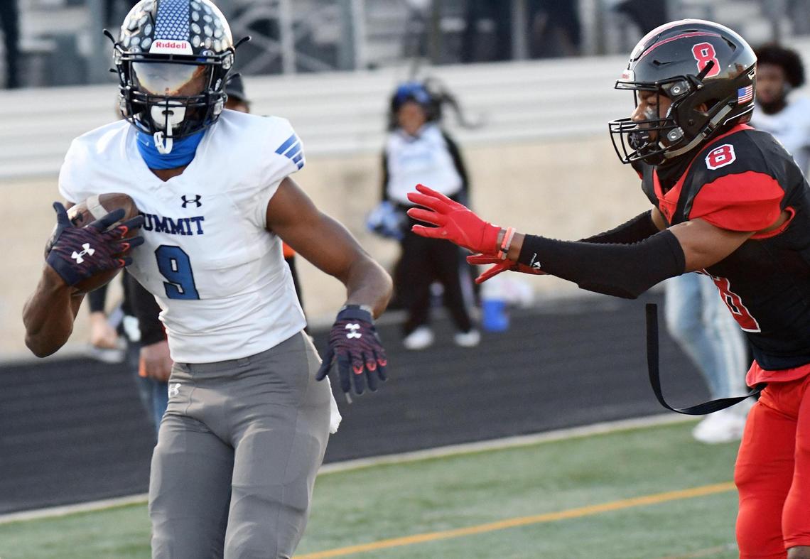 Mansfield Summit’s Hal Presley, left takes a catch in for a touchdown and a 27-17 lead outside the reach of Colleyville Heritage’s Dylahn McKinney in the fourth quarter of their Division 1-5A Regional Round Play-off football game Saturday, December 26, 2020 at Bearcat Stadium in Aledo, Texas. Summit went on to win 34-31. Special/Bob Haynes
