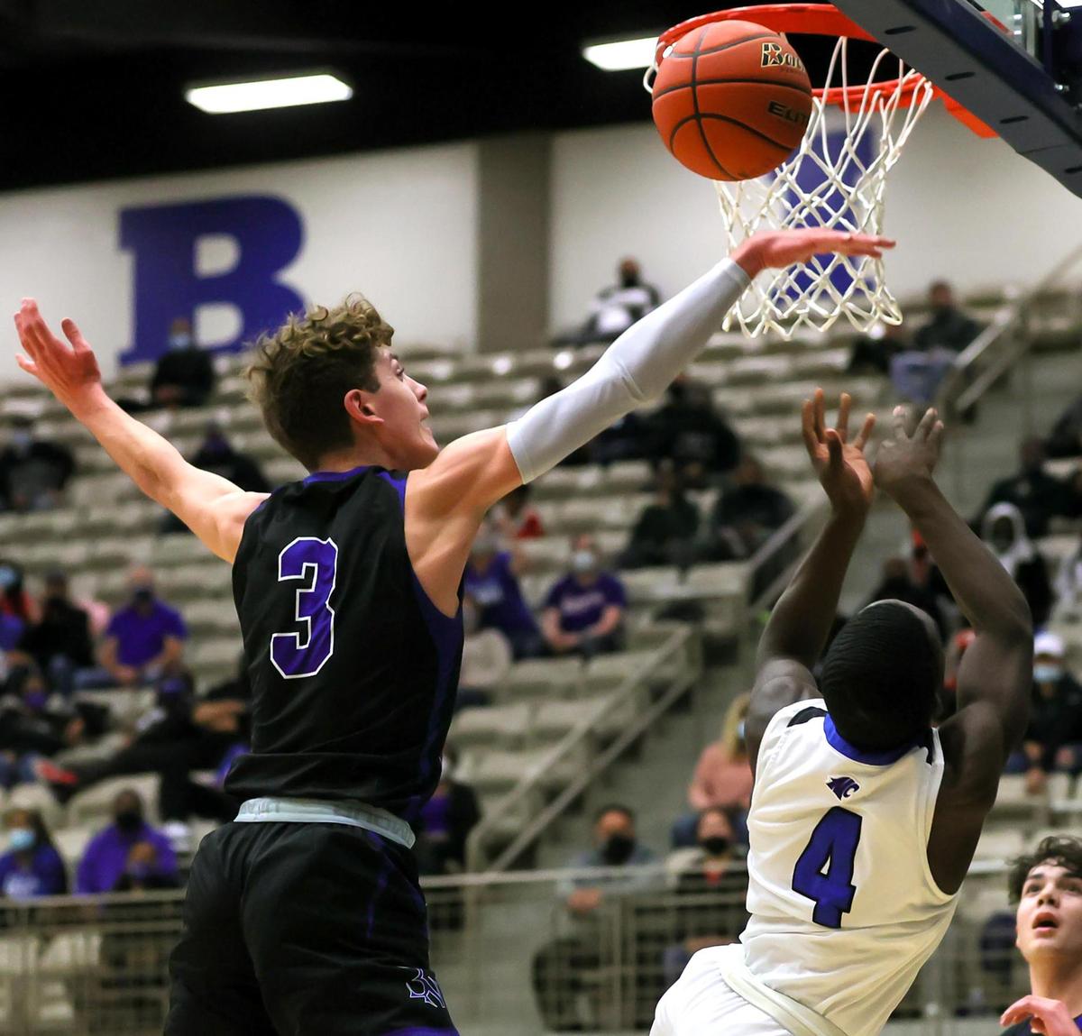Byron Nelson guard Finley Bizjack (3) gets a block on North Crowley guard Remon Tuck (4) during the first half, Friday, February 26, 2021 of a 6A Region 1 Quarterfinal High School playoff Basketball game played at the Thomas Coliseum in Haltom City, Tx. (Steve Nurenberg Special to the Star-Telegram)