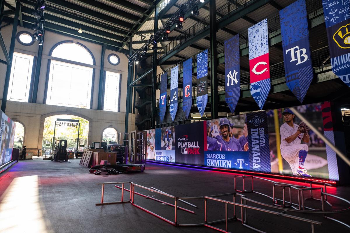 An entry way with banners of teams featured in the All-Star game during the All-Star Village hard hat tour on Thursday, July 11 at the Choctaw stadium in Arlington.