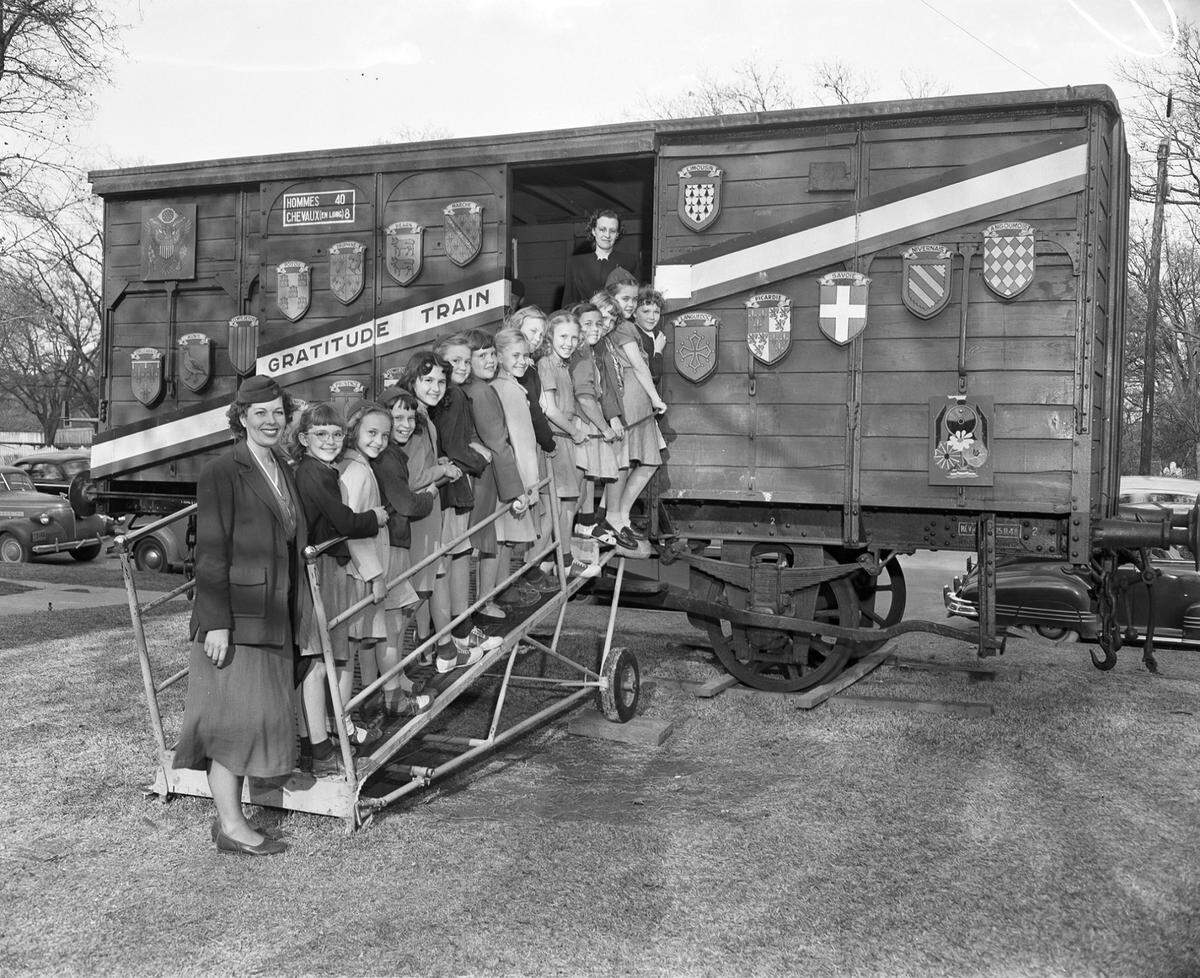 March 21, 1949: Brownies Troop 96 at the souvenir boxcar part of the French “Gratitude Gifts” exhibition at Fort Worth Children’s Museum. From left, Mrs. J.F. Newman (assistant leader), Clarane Clark, Mary Louise McMillen, Nancy Elliott, Sharon Murphy, Gail Craig, Sally Holden, Beverly Buchanan, Reba Nell Fagan, Annette Clark, Kathleen Stinnett, Virginia Lee, Linda Monk, Janet Newman and Mrs. Troy Elliott (leader).