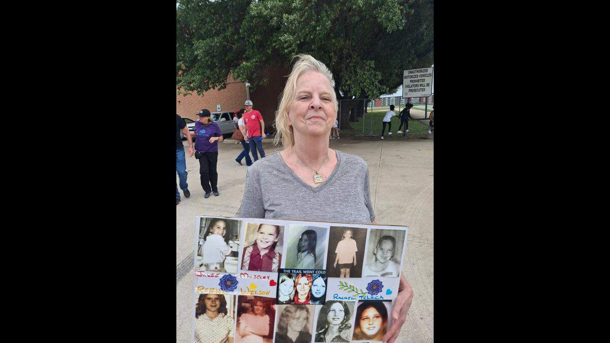 Janet Hensley carries photos of Fort Worth’s “missing trio” at the Thaw The Cold Cases third annual awareness walk April 19. Hensley’s sister, Julie Ann Moseley, was 9 when she disappeared in 1974.