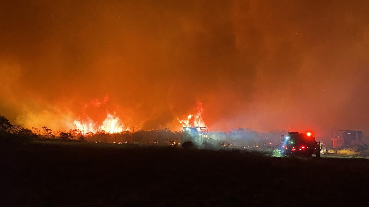 Firefighters continued their battle against a wildfire in Palo Pinto County, which has doubled in size since Thursday and was burning more than 1,500 acres as of Friday afternoon.