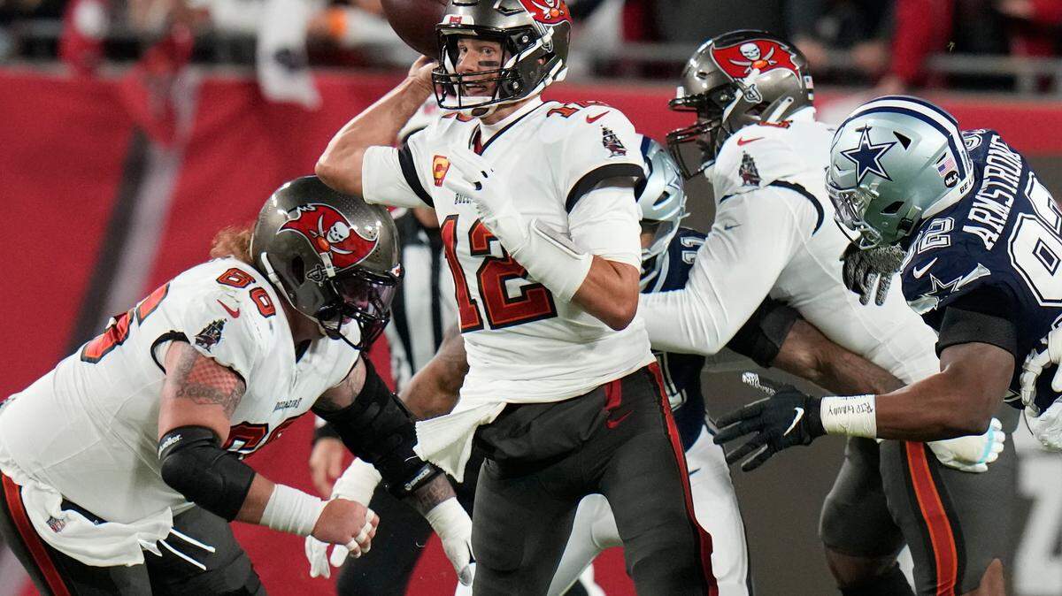 Tampa Bay Buccaneers quarterback Tom Brady (12) works under pressure against Dallas Cowboys during the first half of an NFL wild-card football game, Monday, Jan. 16, 2023, in Tampa, Fla. (AP Photo/Chris O’Meara)