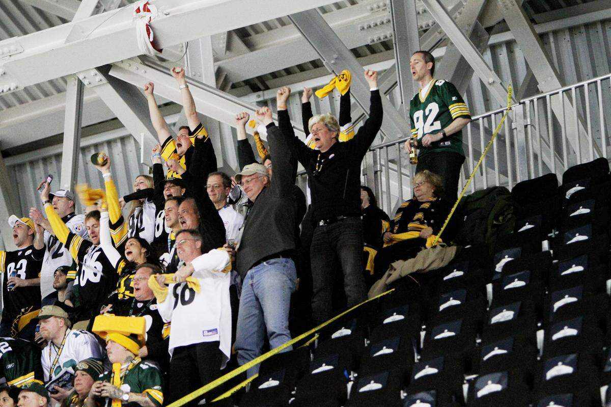 Fans cheer next to a section of temporary seating that was not approved of by the fire marshall near the end of the first half of Super Bowl XLV between the Pittsburgh Steelers and the Green Bay Packers in Arlington, Texas on February 6, 2011. (Andy Jacobsohn/The Dallas Morning News)