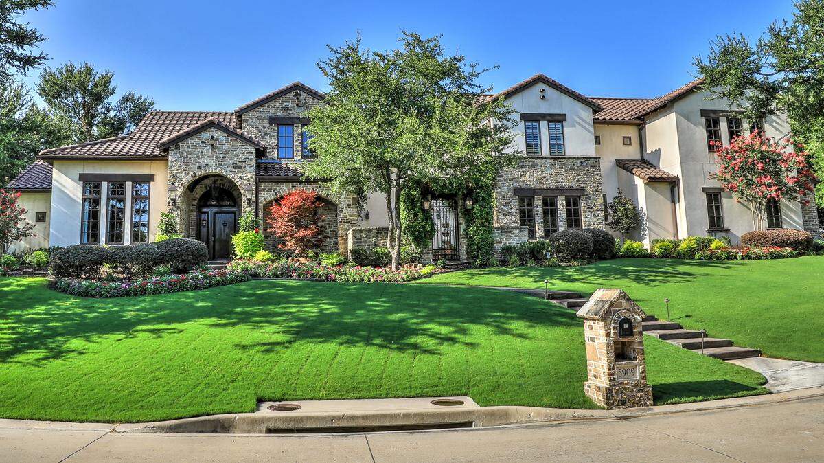 The home at 5909 Kittansett Court stretches across an expansive lot.