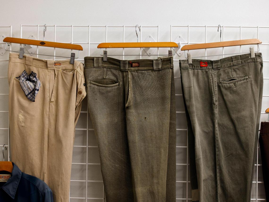 Work pants from the 30’s, 40’s and 50’s hang on a wall in the archive room at Dickies offices in downtown Fort Worth Texas, Thursday Mar. 28, 2024. The 102 year old work apparel company recently relocated to downtown Fort Worth. (Special to the Star-Telegram Bob Booth)