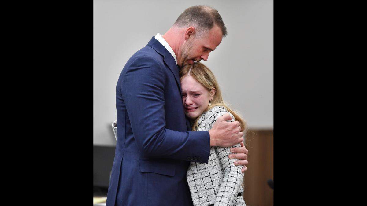 Maya Kowalski hugs her attorney Nick Whitney after a jury awarded her family more than $200 million on Thursday, Nov. 9, 2023. The Kowalski family sued Johns Hopkins All Children’s Hospital for false imprisonment, negligent infliction of emotional distress, medical negligence, battery, and other claims more than a year after the family matriarch, Beata Kowalski, took her life following allegations she was abusing her daughter, Maya Kowalski.