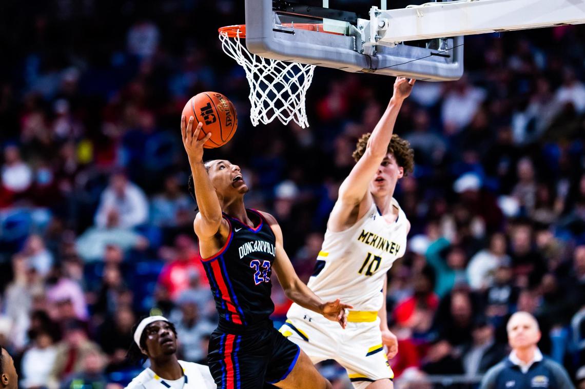 Davion Sykes (22) gets around the defender for a layup during the 6A state final game between Duncanville and McKinney in San Antonio, at the Alamodome, on March 12, 2022. Duncanville won 69-49.