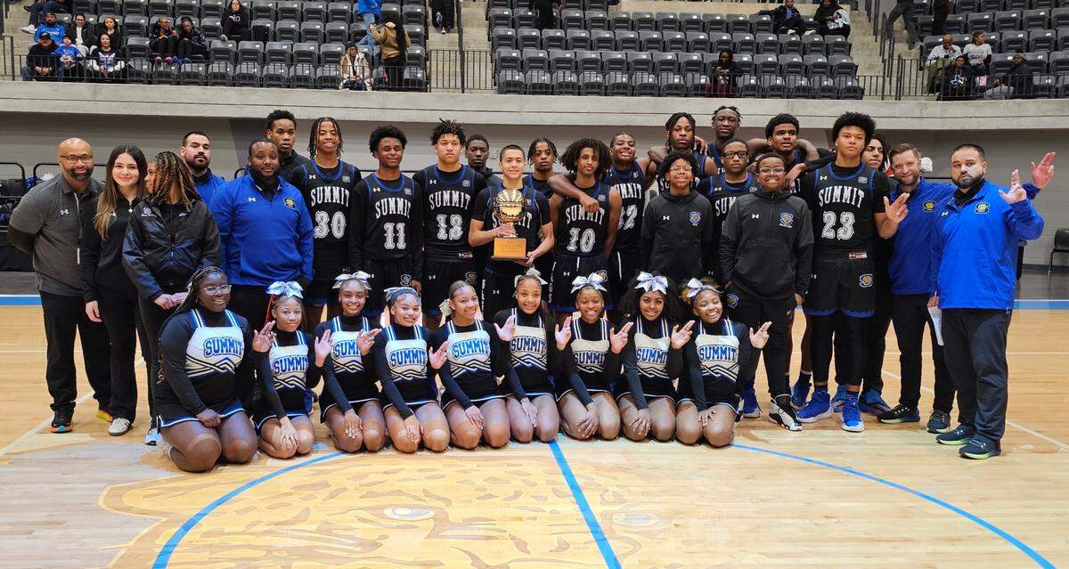 The Mansfield Summit boys basketball team and cheer squad pose with the trophy after defeating Fort Worth Polytechnic in a Class 5A Division 2 bi-district game on Tuesday, February 18, 2025 at the Arlington ISD Athletics Center in Arlington, Texas. Summit defeated Polytechnic 65-31.