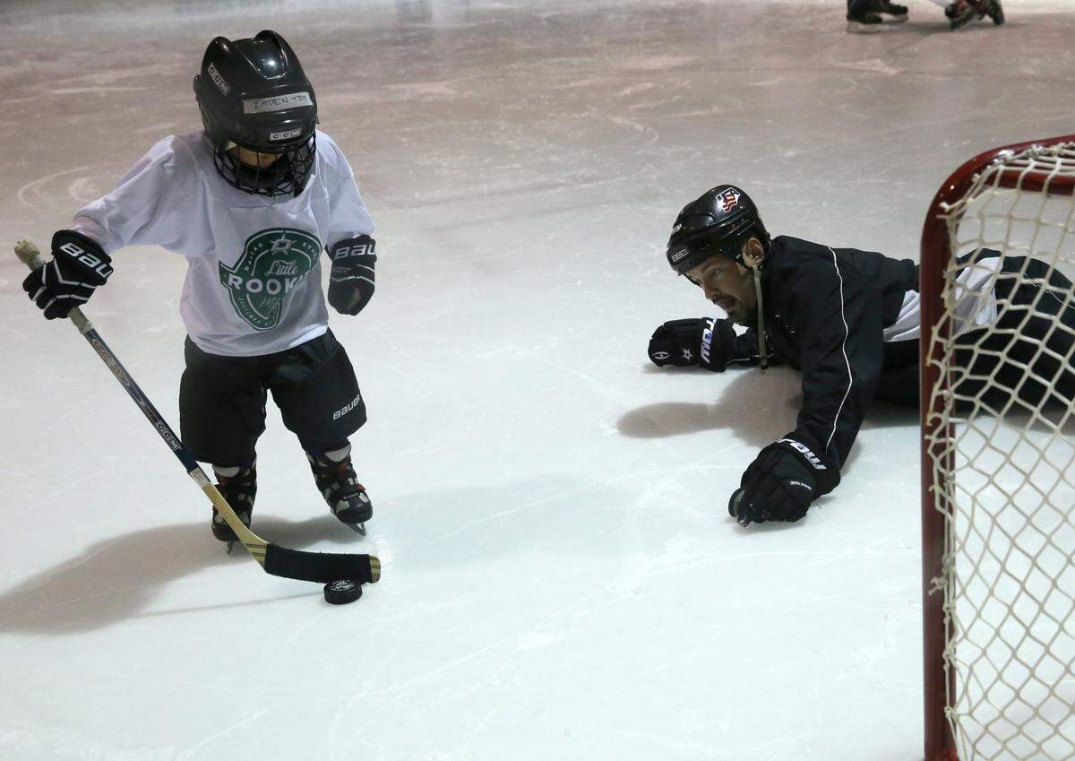 In this 2015 file photo, 4-year-old Zaden Tom of Euless works with coach Jeff Bloomer during a 30-minute class at the Dr. Pepper StarCenter in Euless.