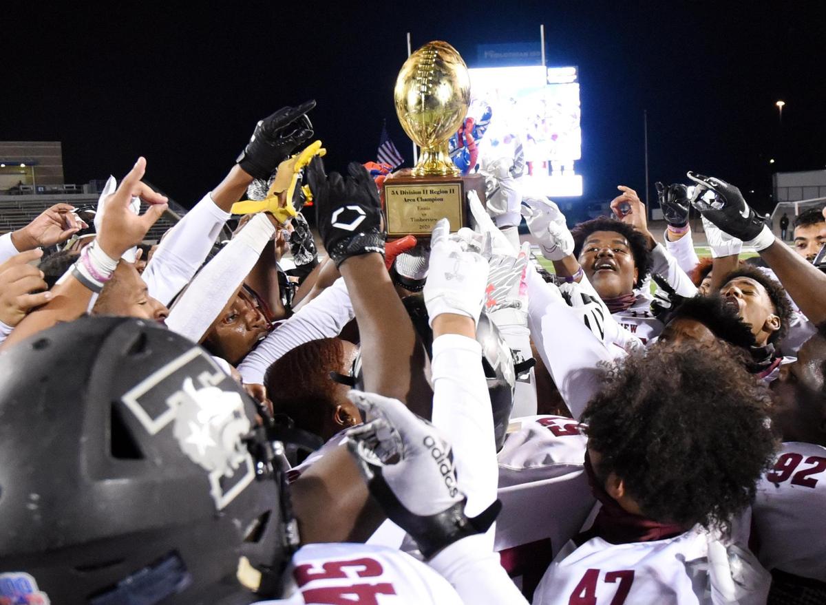 The Mansfield Timberview football team hold up he trophy in celebration after their 42-28 win over Ennis to win the their Division 2 Region 2-5A Area Play-off football game Friday, December 18, 2020 at the Midlothian ISD Multi-Purpose Stadium, Texas. Special/Bob Haynes