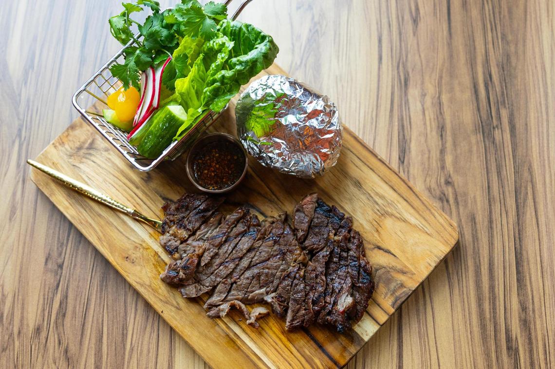 The Crying Tiger ribeye steak served with assorted vegetables and sticky rice at the new Ko Thai restaurant on Magnolia Avenue in Fort Worth on Tuesday, April 29, 2025.