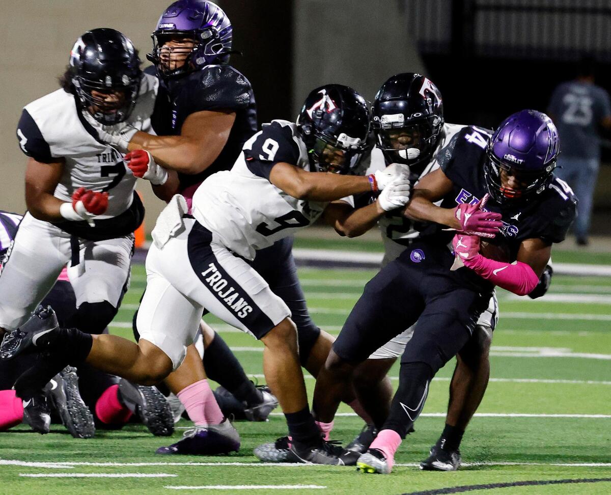 Crowley running back Jordan Green (14) gains two up the middle in the first half of a UIL high school football game at Crowley ISD Multi-Purpose Stadium in Crowley, Texas, Friday, Oct. 20, 2023.