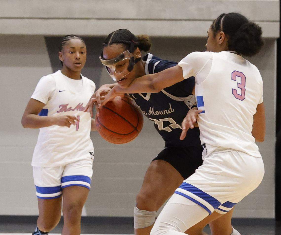 North Crowley guard Zycaria Franklin (3) knocks the ball loose from Flower Mound guard Maci Pringle (23) during the first half of a UIL Class 6A Division I girls regional final basketball playoff game at Arlington ISD Athletics Center in Arlington, Texas, Friday Feb. 27, 2026.