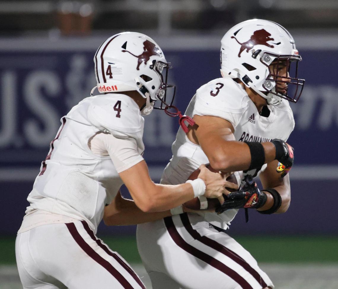 Brownwood quarterback Judson Coalson (4) pulls the ball back from running back Trey Mosley (3) and throws to the flat during a UIL District 4-4A D1 football game at Tarleton State Memorial Stadium in Stephenville, Texas, Friday, Nov. 01, 2024.