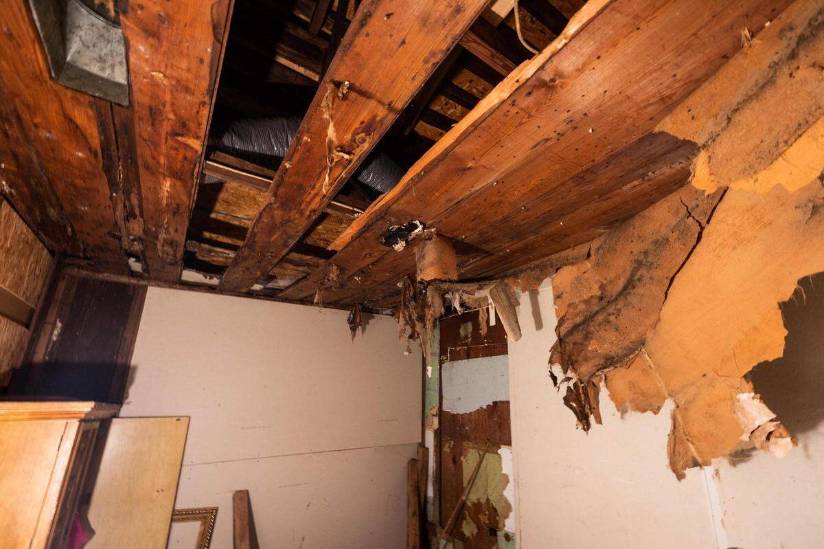 Dortha Smith-White has abandoned a bedroom in her home due to problems with the ceiling and a large hole that reveals the ground.