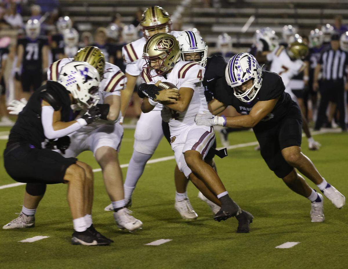 Saginaw running back Elijah Irvin (4) is brought down after a short gain during the first half of a UIL football game between Saginaw and Paschal at Farrington Field in Fort Worth, Texas, Thursday, October, 16, 2025.