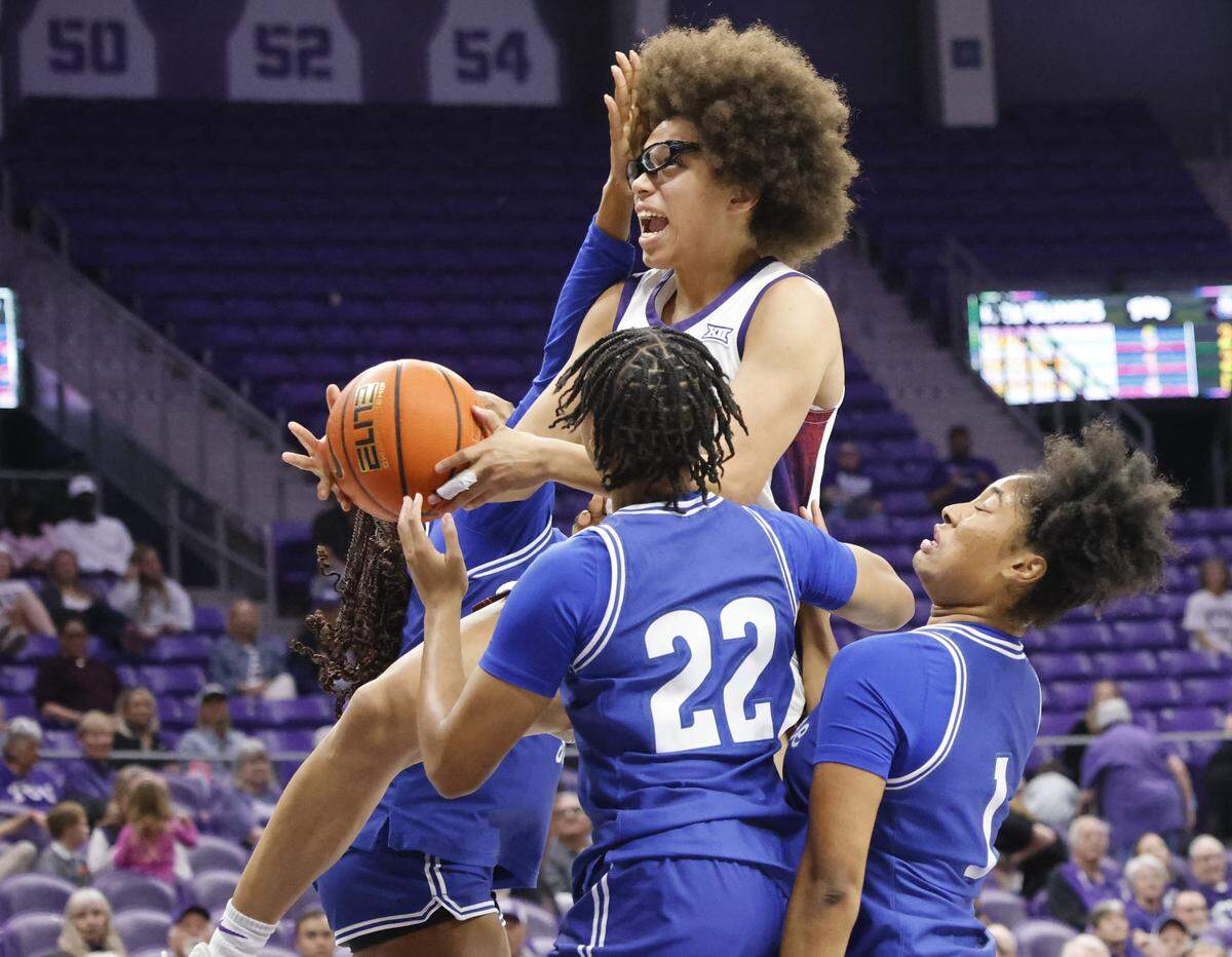 TCU guard Olivia Miles (5) gets a shot off in triple coverage during the first quarter of a NCAA women's basketball game between Tennessee State and TCU at Schollmaier Arena in Fort Worth, Texas, Wednesday Nov. 12, 2025.