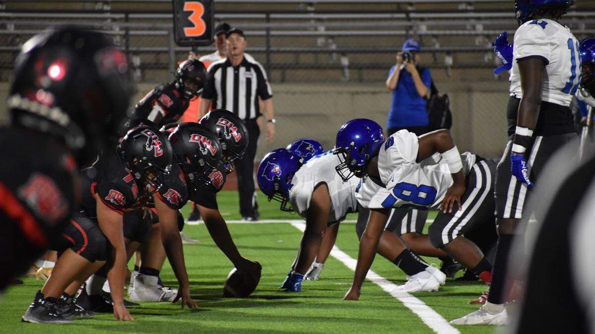 Fort Worth Dunbar faces off against Fort Worth Diamond Hill-Jarvis during a high school football game at Clark Stadium in Fort Worth, Texas Thursday, September 21, 2023.