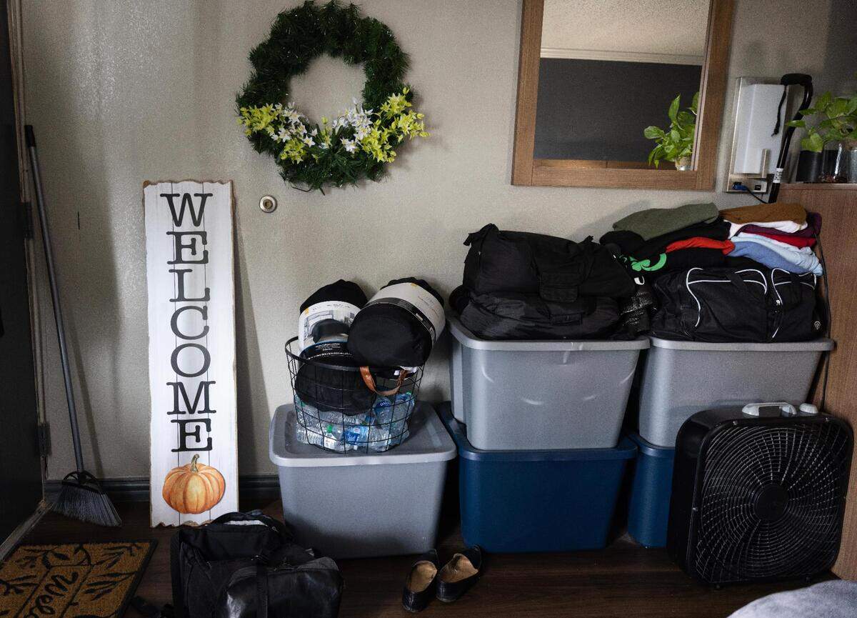 Belongings are stored in Charlotte Smith’s hotel room at White Settlement’s Red Roof Inn on May 4, 2023. Smith and her daughter have struggled to find housing after being evicted.
