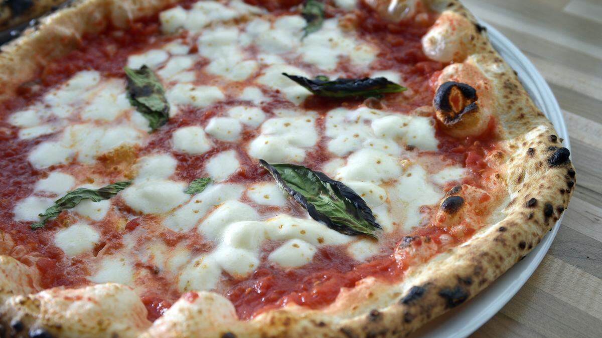 Neapolitan-style pizza with mozzarella and basil.