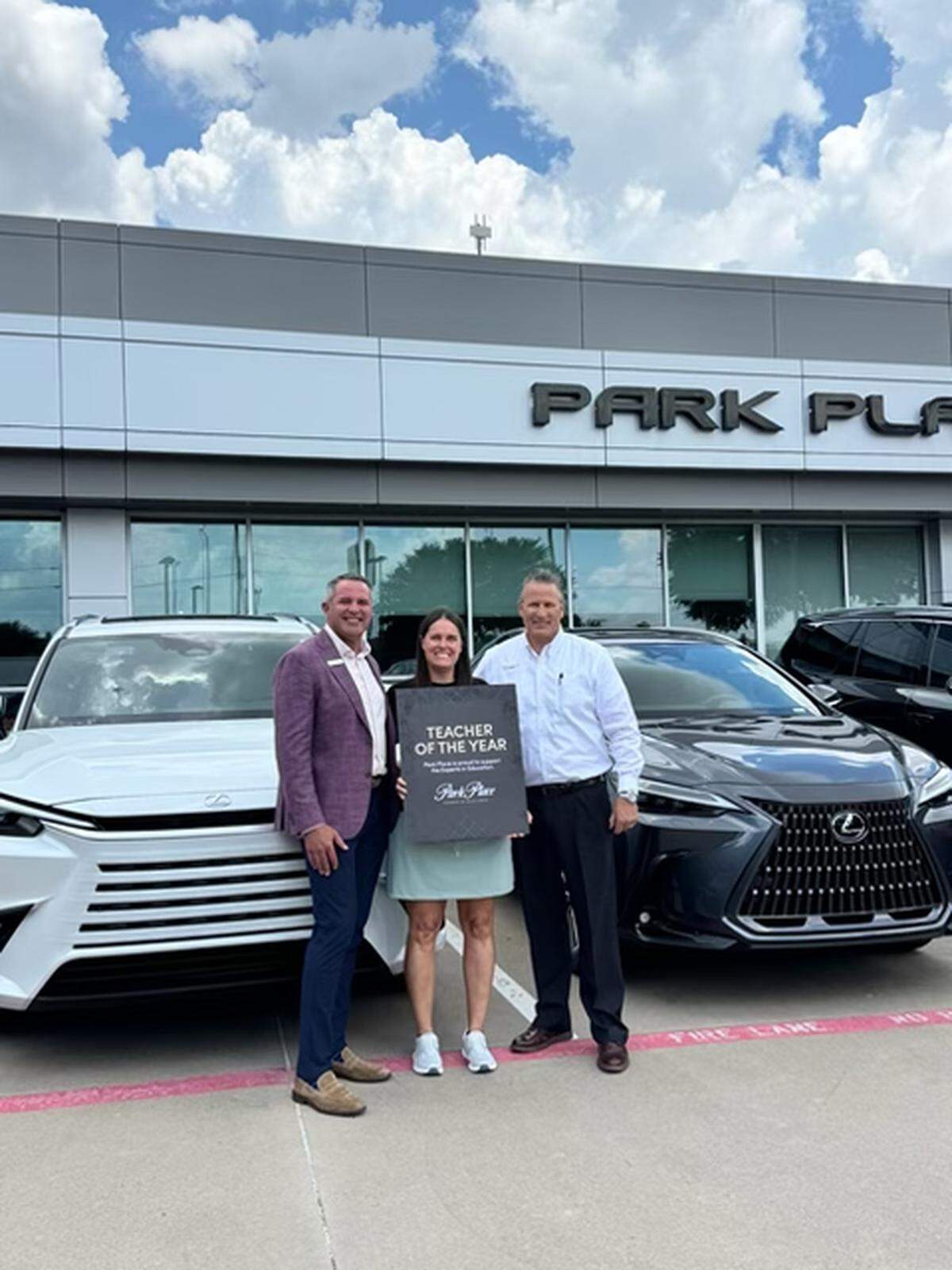 Teacher Stephanie Maupin with Charles Owen General Manager of Park Place Lexus Grapevine and Pete Bagrow General Sales Manager Park Place Lexus Grapevine.