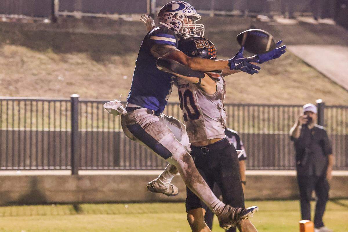 Decatur’s Chase Berg makes an incredible catch behind the back of Springtown defensive back Caden Rodgers at the Friday, Nov. 1 game at Decatur. Special to the Star-Telegram / Tom Marvin