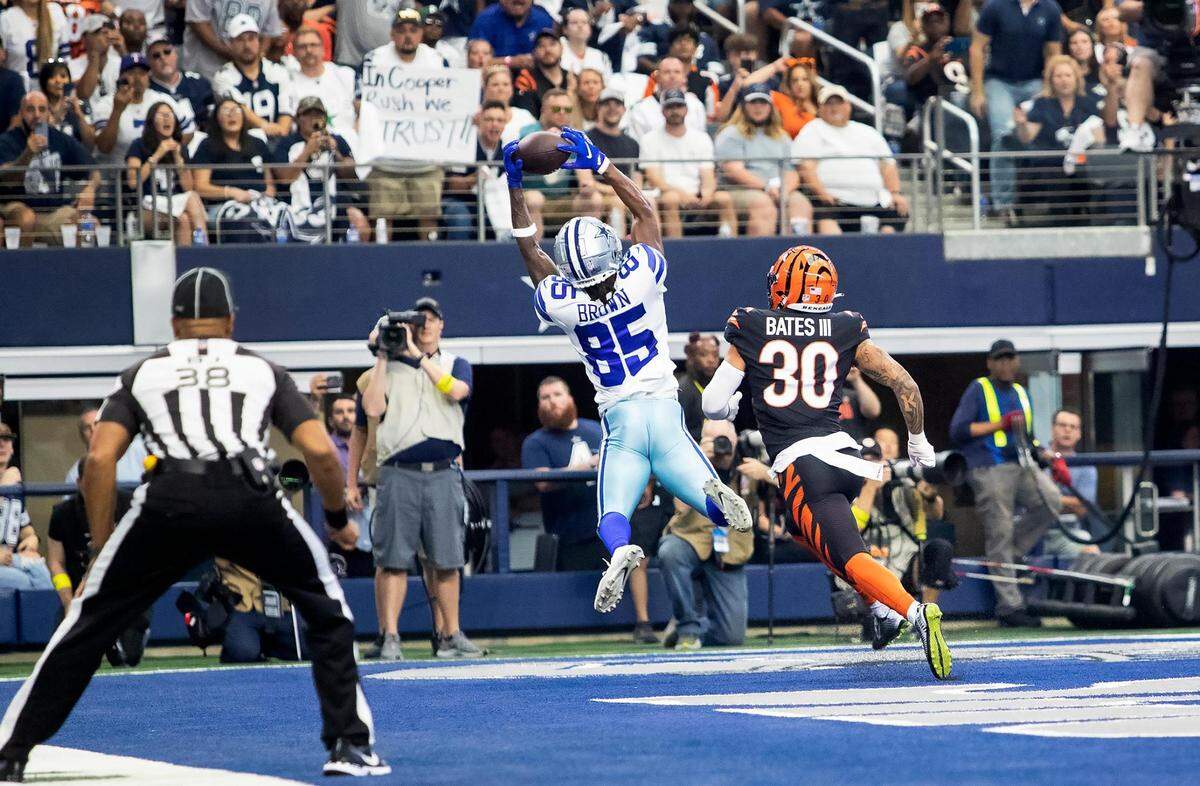 Dallas Cowboys wide receiver Noah Brown catches the ball for a touchdown as Cincinnati Bengals safety Jessie Bates III watches on Sunday, September 18, 2022.